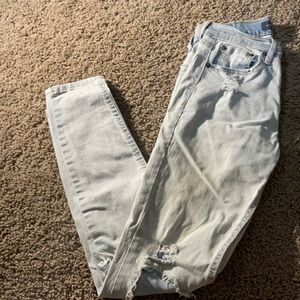 light blue ripped jeans